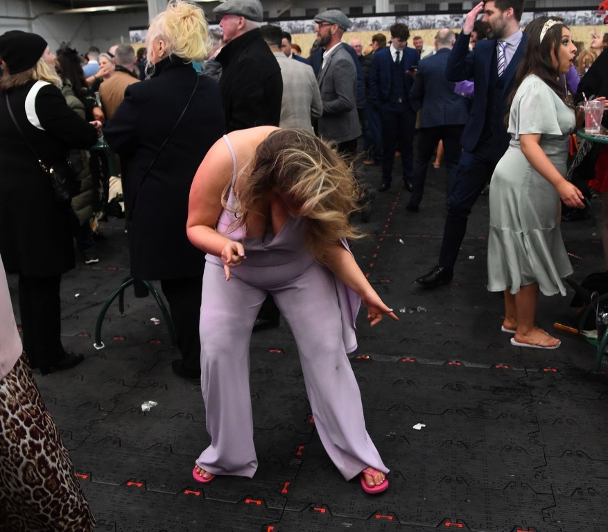 Aintree Revelers Get Into The Party Spirit At The Grand National As Racers Enjoy Booze And Plucky Frosts. By Evening, One Lady Changed Her Heels To Flip-Flops Before Stepping Onto The Dance Floor.