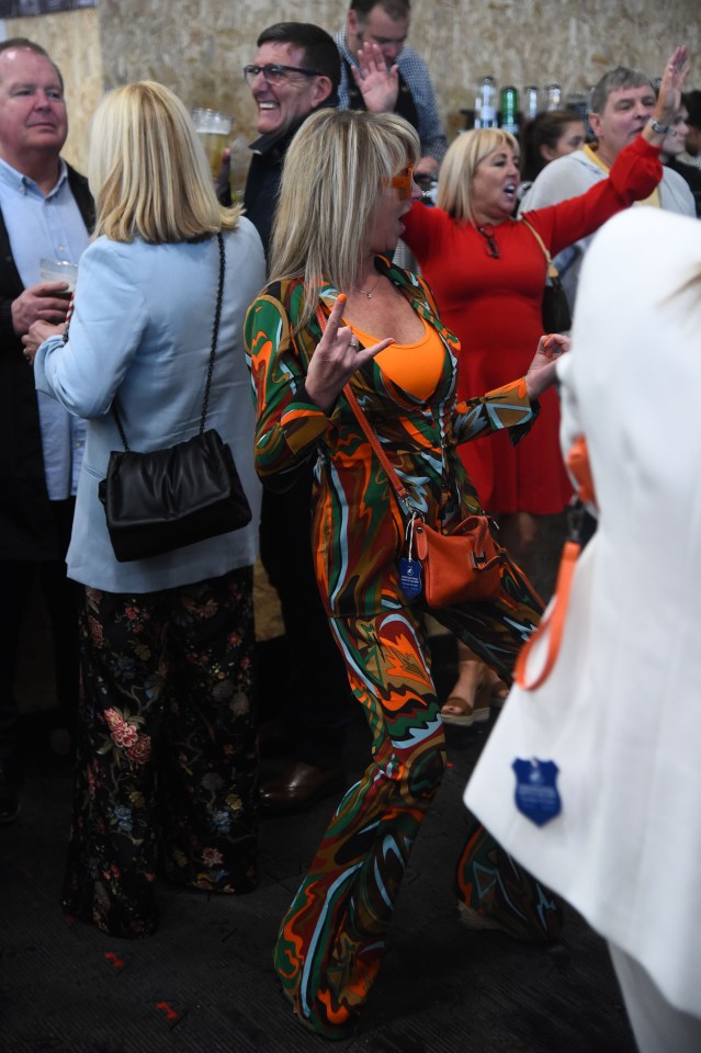 Aintree Revelers Get Into The Party Spirit At The Grand National As Racers Enjoy Booze And Plucky Frosts. She Was Quickly Joined By Others Who Enjoyed The Music.